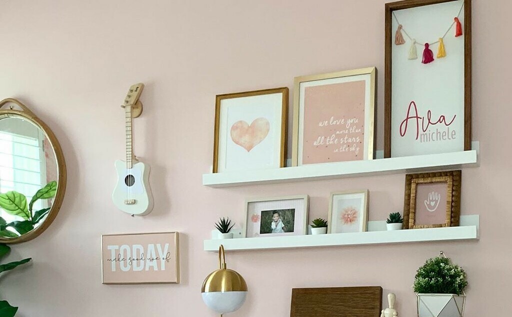 Accent wall with frames photos on shelf