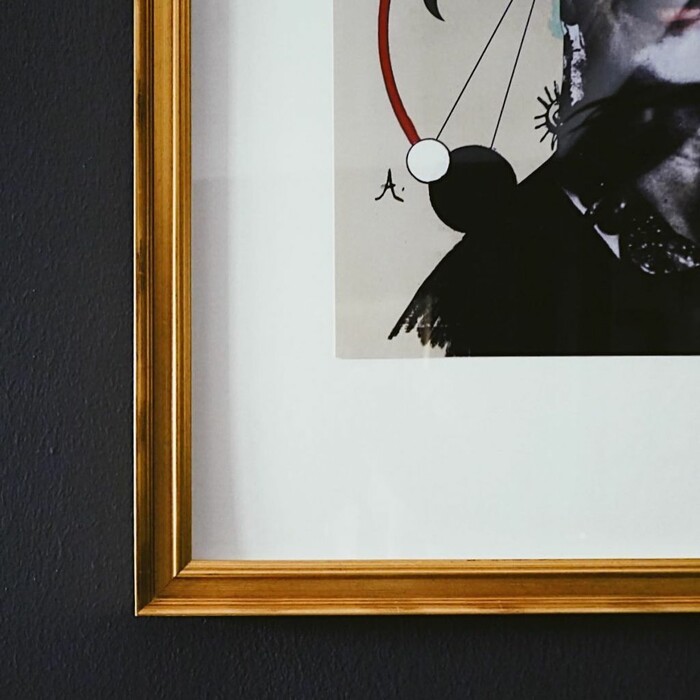 Close up of the Acadmie Gold picture frame from Level Frames